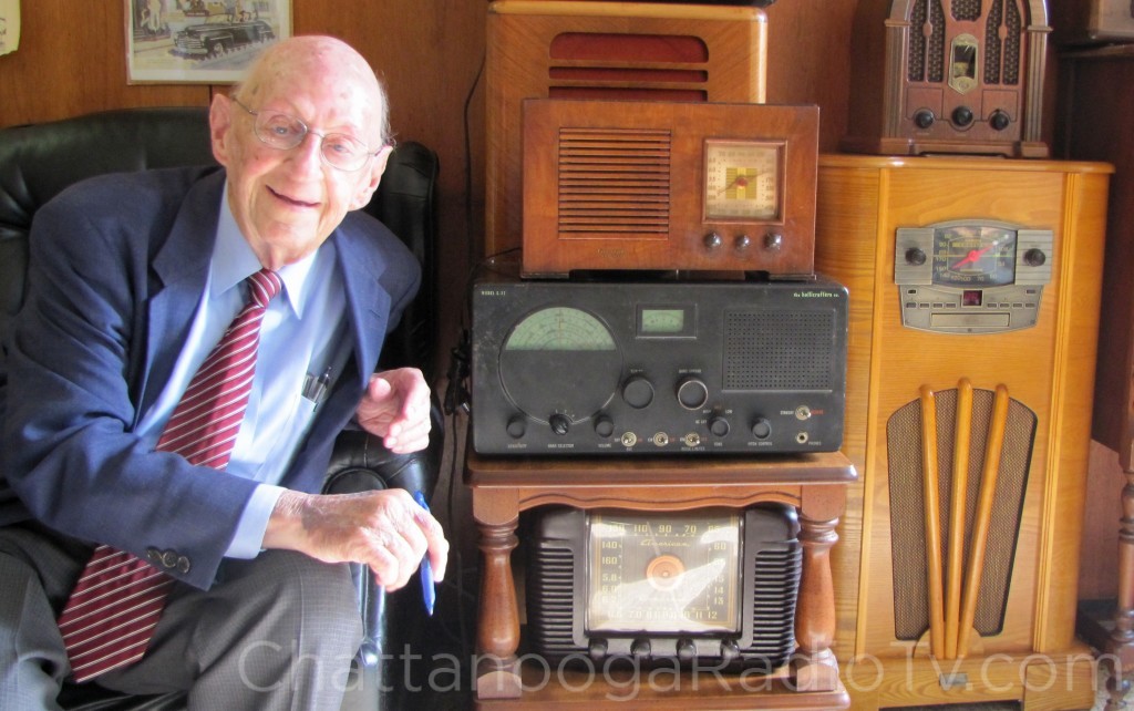 Luther Masingill, Aug. 13, 2013 with vintage radios in the lobby of WFLI