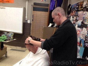 Chris shaving the head of his dad, Craig DeRogatis