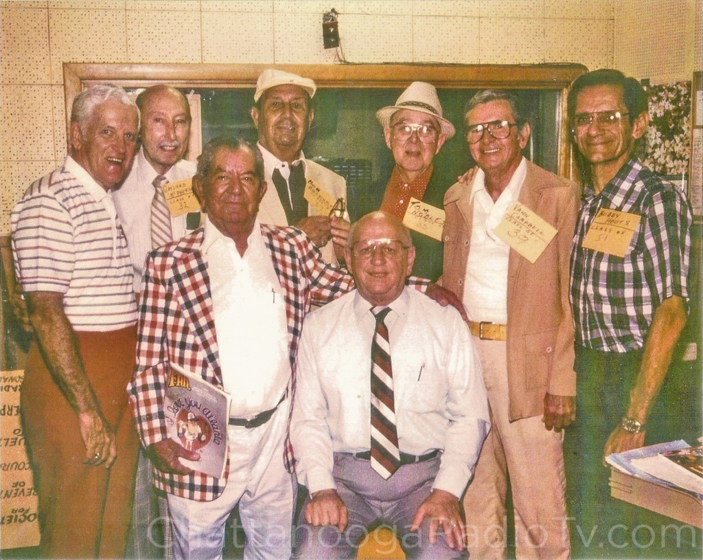 Luther is seated, along with (L-R) Ernie Feagans, Gaylord McPherson, Abe Zarzour, Bob Bosworth, Tom Nobles, Vann Campbell, and Buddy Houts.